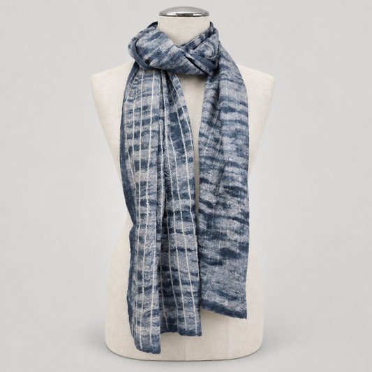 Scarf displayed on a cream mannequin with a soft gray studio background