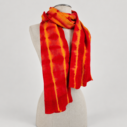 Scarf displayed on a cream mannequin with a soft gray studio background