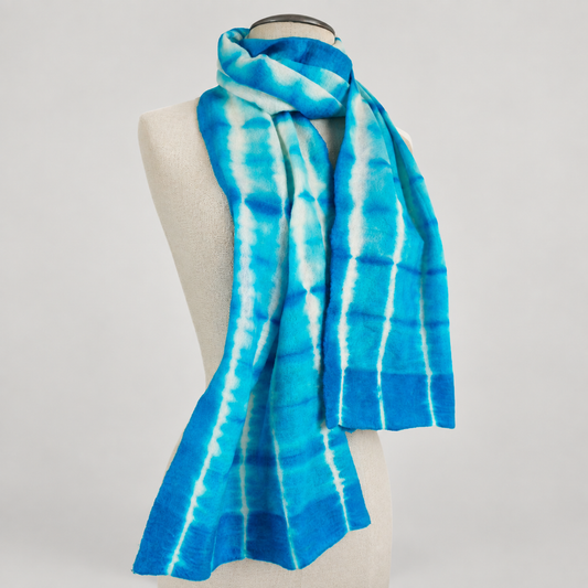 Scarf displayed on a cream mannequin with a soft gray studio background