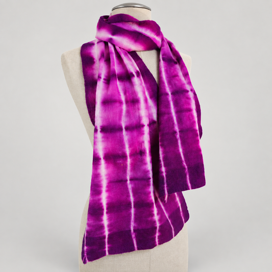 Scarf displayed on a cream mannequin with a soft gray studio background