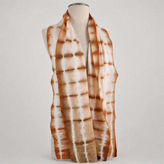 Scarf displayed on a cream mannequin with a soft gray studio background
