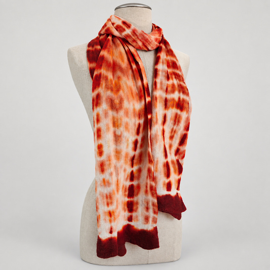 Scarf displayed on a cream mannequin with a soft gray studio background