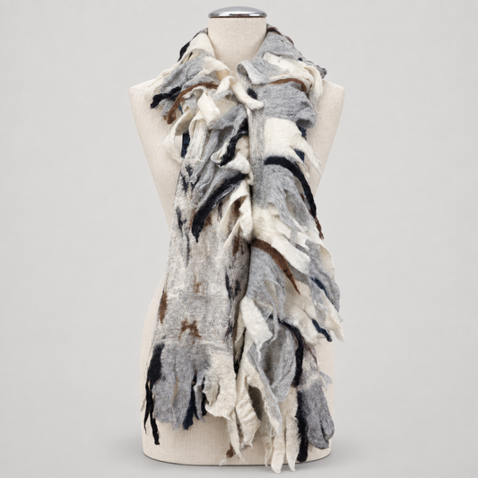 Scarf displayed on a cream mannequin with a soft gray studio background