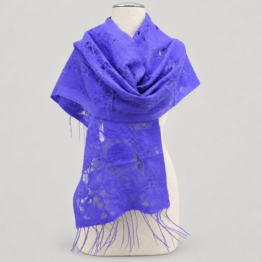 Scarf displayed on a cream mannequin with a soft gray studio background