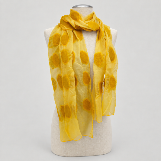 Scarf displayed on a cream mannequin with a soft gray studio background