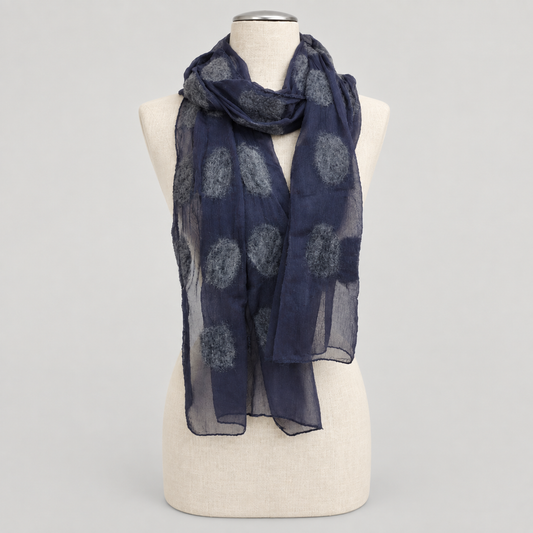 Scarf displayed on a cream mannequin with a soft gray studio background